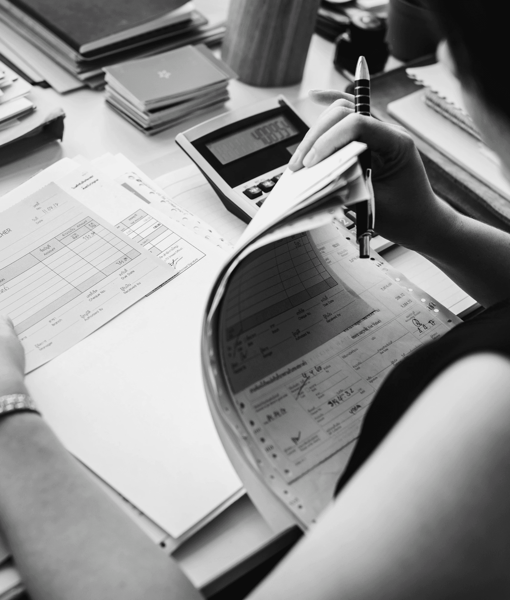 Reviewing financial records at a desk